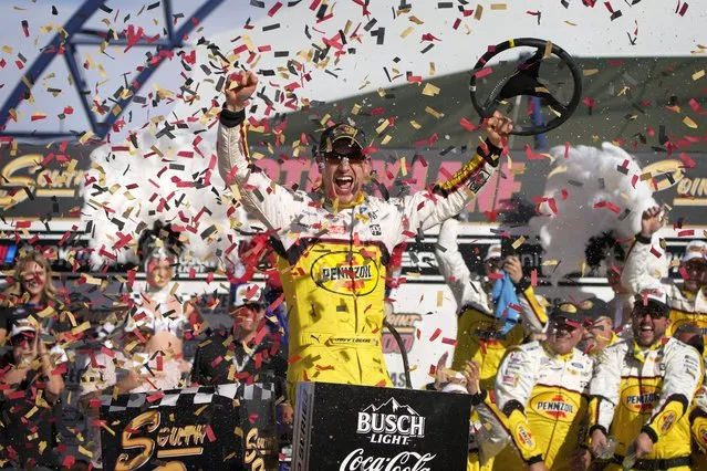 Joey Logano celebrates after winning a NASCAR Cup Series auto race Sunday, October 16, 2022, in Las Vegas. (Photo by John Locher/AP Photo)
