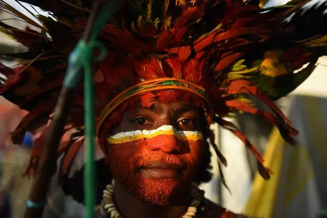 A man in traditional dress waits to participate at an event at the sports stadium to mark 40 years of independence in Port Moresby, Papua New Guinea, 16 September 2015. It was on this day in 1975 that Papua New Guinea gained independence from Australia. (Photo by Mick Tsikas/EPA)