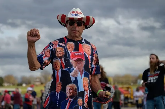 An attendee arrives for a “Save America” rally ahead of the midterm elections at Arnold Palmer Regional Airport in Latrobe, Pennsylvania, on November 5, 2022. (Photo by Angela Weiss/AFP Photo)