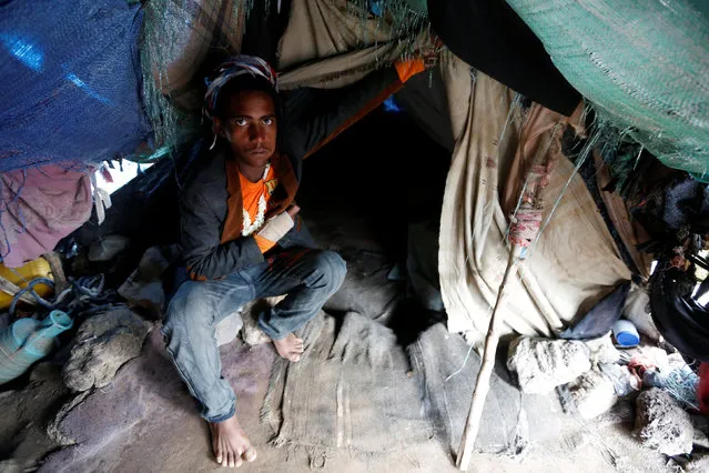 A man shows his tent at a camp for internally displaced people near Sanaa, Yemen, August 10, 2016. (Photo by Khaled Abdullah/Reuters)