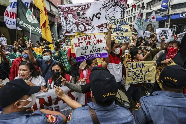 Protesters hold a rally as they tried to march near Malacanang Palace against the visit of U.S. Vice President Kamala Harris in Manila Monday, November 21. 2022. (Photo by Gerard V. Carreon/AP Photo)