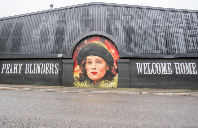 A stunning Peaky Blinders mural has been completed on January 9, 2025 at Steven Knight's Birmingham studios – and is attracting visitors from across the globe. The massive artwork of characters Tommy Shelby, Ada Shelby and Alfie Solomon now adorns the side of Digbeth Loc Studios. Artist Daniel Russell-Ahern, AKA Mr Mural, spent more than 210 hours and three weeks spray-painting the incredible mural along Montague Street. (Photo by Joseph Walshe/South West News Service)