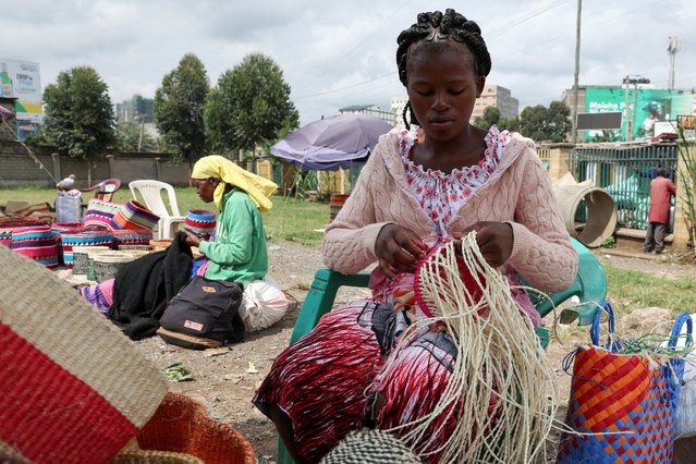 Grace Muinde weaves sisal and recycled polythene to make a traditional handwoven basket known as Kiondo at the Mwariro Market in Kariokor district of Nairobi, Kenya on June 4, 2025. (Photo by Monicah Mwangi/Reuters)