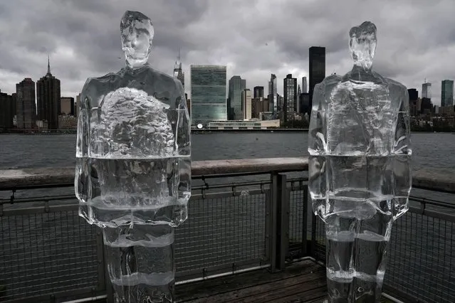 Two ice sculptures depicting U.S. President Donald Trump and Brazil's President Jair Bolsonaro sit across the Hudson River from the United Nations headquarters in the Queens Borough of New York City, New York, U.S., September 30, 2020. (Photo by Carlo Allegri/Reuters)