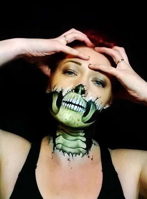The bottom half on this womans mouth is a skull in a face painting by Nikki Shelley. (Photo by Nikki Shelley/Caters News)