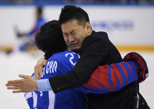 South Korean head coach Kwang Suk Seo, right, hugs Byeong Seok Cho after South Korea's victory over Italy in the Ice Hockey Bronze Medal Game at the Gangneung Hockey Centre in Gangneung, South Korea at the 2018 Winter Paralympics Saturday, March 17, 2018. (Photo by Joel Marklund/OIS/IOC via AP Photo)