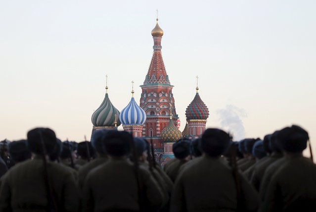 Russian servicemen, dressed in historical uniforms, line up as they take part in a military parade rehearsal in front of St. Basil's Cathedral in Red Square in central Moscow, Russia, November 6, 2015. (Photo by Maxim Shemetov/Reuters)