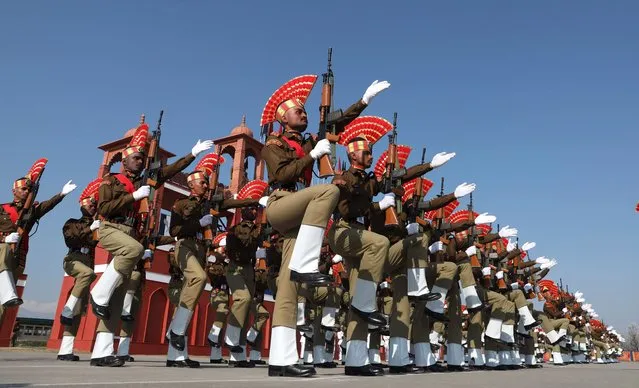 New recruits of the Indian Border Security Force (BSF) march as they take part during a passing out parade in Humhama, on the outskirts of Srinagar, the summer capital of Indian Kashmir, 15 March 2023. A total of 119 recruits were formally inducted into the BSF, an Indian paramilitary force, after completing 44 weeks of training in physical fitness, weapon handling, commando operations and counter insurgency, a BSF spokesman said. (Photo by Farooq Khan/EPA)