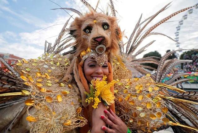 A Brazilian dancer performs during the flowers parade as part of the 137th edition of Nice's Carnival with the theme “King of Animals” in Nice, France, February 13, 2022. (Photo by Eric Gaillard/Reuters)