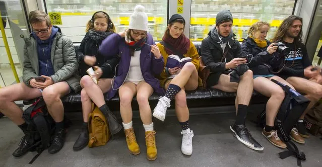 People take part in the No Pants Subway Ride in Berlin January 11, 2015. (Photo by Hannibal Hanschke/Reuters)