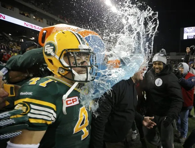 Edmonton Eskimos head coach Chris Jones is doused with water after the team's victory over the Ottawa Redblacks during the CFL's 103rd Grey Cup championship football game in Winnipeg, Manitoba, November 29, 2015. (Photo by Mark Blinch/Reuters)
