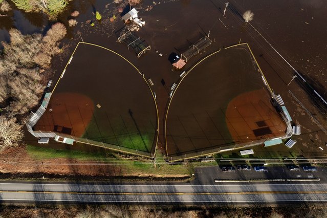A drone view shows baseball fields flooded by the Snoqualmie River in Fall City, Washington, on December 9, 2025. (Photo by David Ryder/Reuters)