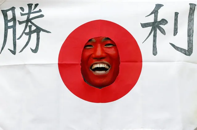 A Japan fan laughs before the Russia 2018 World Cup Group H football match between Colombia and Japan at the Mordovia Arena in Saransk on June 19, 2018. (Photo by Jack Guez/AFP Photo)