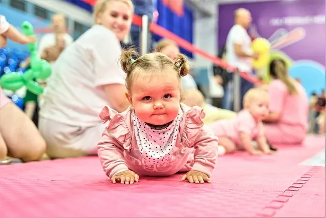A baby takes part in a baby crawling race in Vladivostok, Russia, July 8, 2023. July 8 marks the Day of Family, Love and Fidelity in Russia. A baby crawling race was held in Russia's Far East city of Vladivostok to celebrate the occasion. (Photo by Xinhua News Agency/Rex Features/Shutterstock)