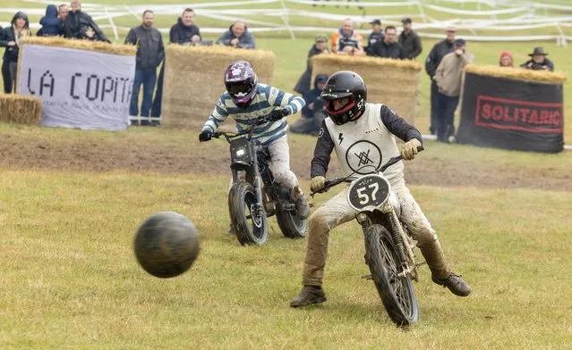 Competitors at Malle Mile, “the most inappropriate motorcyle race and festival in the country”, play moto polo at Grimsthorpe Castle in Lincolnshire, United Kingdom in the last decade of July 2023. (Photo by Rod Kirkpatrick/F Stop Press)