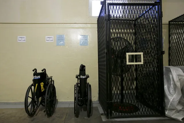 Two wheelchairs are lined against a wall in the East Block for condemned inmates during a media tour of California's Death Row at San Quentin State Prison in San Quentin, California December 29, 2015. (Photo by Stephen Lam/Reuters)