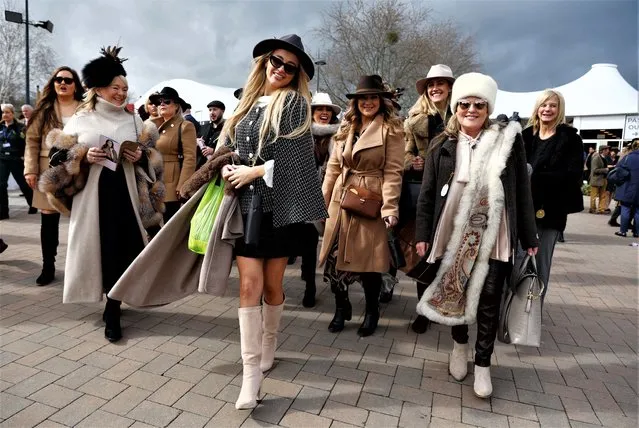 Horseracing enthusiasts arrive for a day of racing at the Cheltenham Festival in Cheltenham, Britain on Friday, March 17, 2023. (Photo by Paul Childs/Reuters)