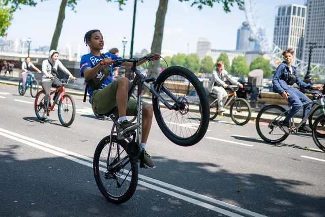 A group of young men ride bicycles along Embankment, London on Thursday, June 3, 2021. (Photo by Aaron Chown/PA Images via Getty Images)