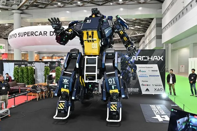 Japanese robotics startup Tsubame Industries exhibit the ARCHAX robot, weighing 3.5 tonnes and measuring 4.5 meters in height, during the press day of the Japan Mobility Show in Tokyo on October 25, 2023. (Photo by Kazuhiro Nogi/AFP Photo)