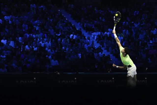 Spain's Carlos Alcaraz serves to Serbia's Novak Djokovic during their singles semifinal tennis match of the ATP World Tour Finals at the Pala Alpitour, in Turin, Italy, Saturday, November 18, 2023. (Photo by Antonio Calanni/AP Photo)