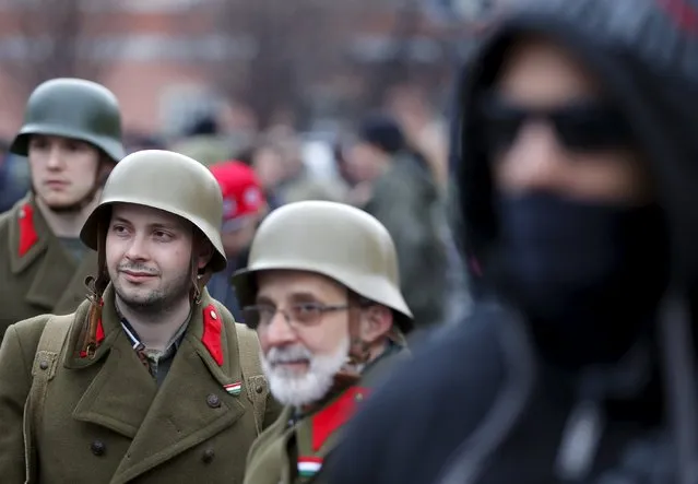 Neo-Nazi groups commemorate the “Day of Honour” in Budapest, Hungary February 13, 2016. The group is commemorating the breakout attempt by Schutzstaffel (SS) troops from Soviet-surrounded Budapest during World War Two. The Schutzstaffel was a Nazi military organisation under Adolf Hitler and the Nazi Party. (Photo by Laszlo Balogh/Reuters)