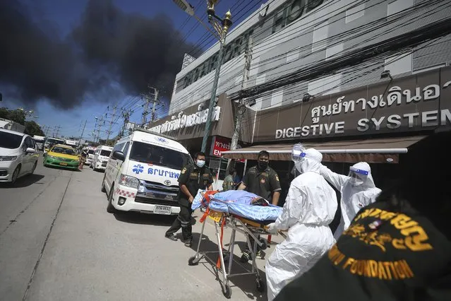 Patients are evacuated from the Chularat 9 Hospital following a massive explosion and fire at a factory in the Samut Prakan province, Thailand, Monday, July 5, 2021. (Photo by Nava Natthong/AP Photo)