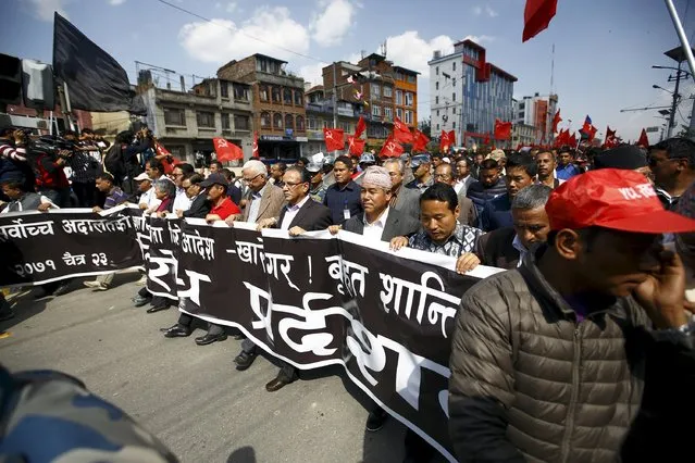 Chairman of the Unified Communist Party of Nepal (Maoist) Pushpa Kamal Dahal, also known as Prachanda, (C) along with senior leaders of various Maoist parties, takes part in a protest rally in Kathmandu April 6, 2015. According to the local media reports, Maoist parties took out a rally against the Supreme Court verdict that disallowed providing mass amnesty to those facing accusations for crimes during civil war. (Photo by Navesh Chitrakar/Reuters)