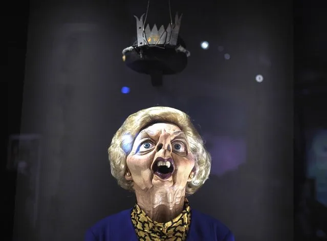 A Margaret Thatcher puppet from “Spitting Image”, 2020, is paired with Judy Blame's crown headpiece from Galliano's “Forgotten Innocents”, A/W 1986-7, on display during the preview for The Horror Show! exhibition at Somerset House, London on Wednesday, October 26, 2022. The exhibition shows horror's impact on the last 50 years of creative rebellion in Britain. (Photo by Yui Mok/PA Images via Getty Images)