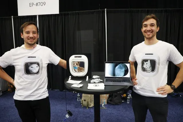 Co-founders (L-R) Oliver Widler and Denis Widler of Flappie Technologies, pose for a photo with the Flappie AI cat door, on display during the 2024 International CES, at the Mandalay Bay Convention Center in Las Vegas, Nevada on Sunday, January 7, 2024. The Flappie AI cat door stops your pet from gifting you dead prey. (Photo by James Atoa/UPI/Rex Features/Shutterstock)