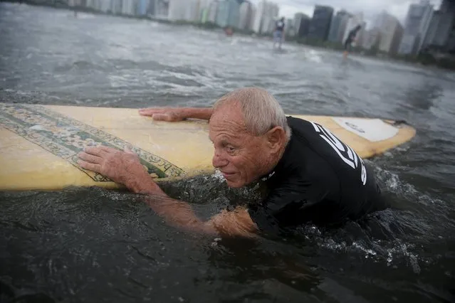 Francisco Aguiar, 71, takes part in his surf class in Santos, Sao Paulo state, Brazil March 16, 2016. (Photo by Nacho Doce/Reuters)