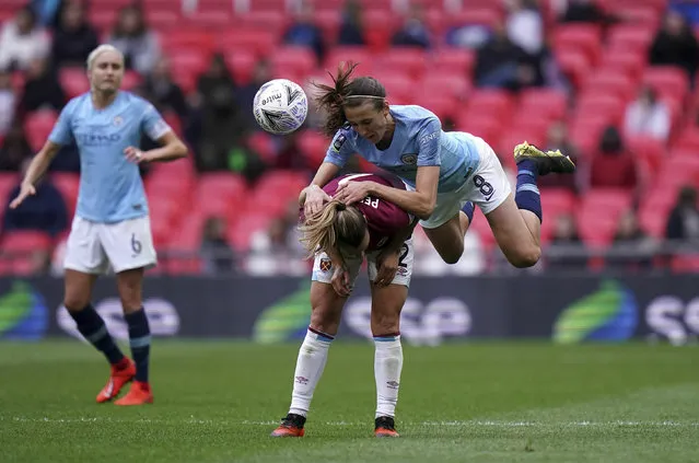 West Ham's Ria Percival and Manchester City's Jill Scott, top, battle for the ball during the Women's FA Cup Final at Wembley Stadium, London, Saturday May 4, 2019. (Photo by John Walton/PA Wire via AP Photo)