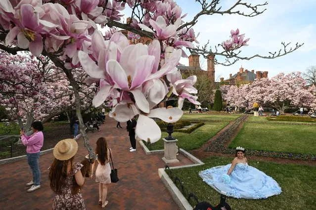 Diana Castellon, 16, of Arlington, VA, right, has photos taken for her upcoming quinceanera at Haupt Garden on Wednesday March 13, 2024 in Washington, DC. She celebrates her quinceanera on April 6th. (Photo by Matt McClain/The Washington Post)