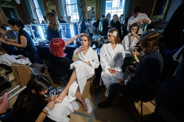 Models are prepared for the Julien Macdonald show during London Fashion Week on February 20, 2017 in London, England. (Photo by Leon Neal/Getty Images)