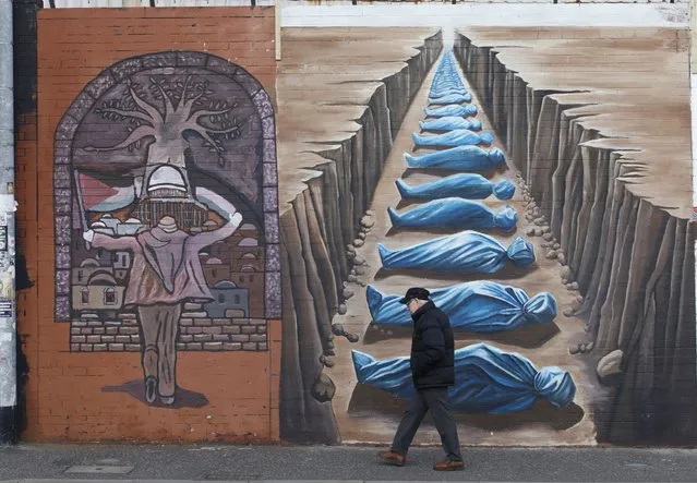 A view of the city's iconic “International Wall” transformed by a group of artists into the “Palestine Wall” with a series of new murals that stand in solidarity with Palestinian people, on March 07, 2024, at Falls Road in Belfast, Northern Ireland. (Photo by Conor McCaughley/Anadolu via Getty Images)