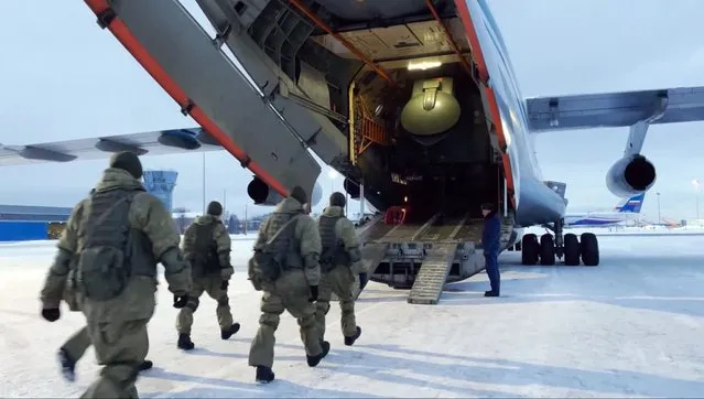 In this photo taken from video released by the Russian Defense Ministry Press Service, Russian peacekeepers board on a Russian military plane at an airfield outside Moscow, in Russia to fly to Kazakhstan Thursday, January 6, 2022. A Russia-led military alliance, the Collective Security Treaty Organization, said early Thursday that it would send peacekeeper troops to Kazakhstan at the request of President Kassym-Jomart Tokayev. (Photo by Russian Defense Ministry Press Service via AP Photo)
