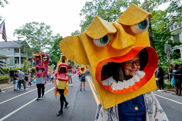 Members of the Big Mask Project march in the parade for the 52nd Inman Park Festival & Tour of Homes in Atlanta, Georgia, USA, 27 April 2024. The popular springtime festival began to bring attention to the revitalization of one of Atlanta's oldest neighborhoods founded in the late 1800s. (Photo by Erik S. Lesser/EPA/EFE)