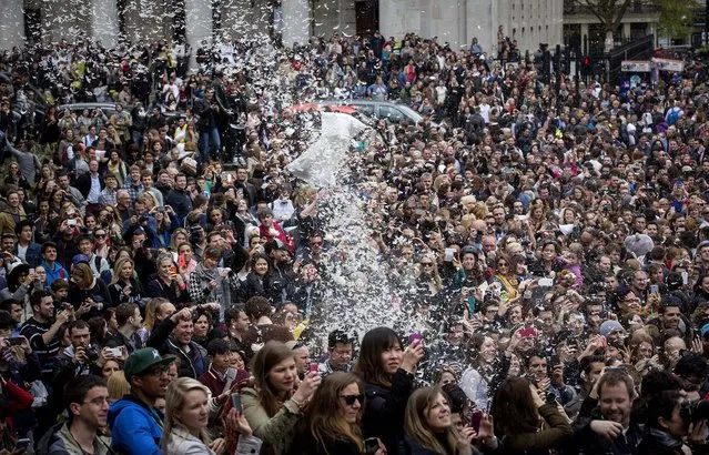Revelers take part in the giant pillow fight in London. (Photo by Rob Stothard/Getty Images)