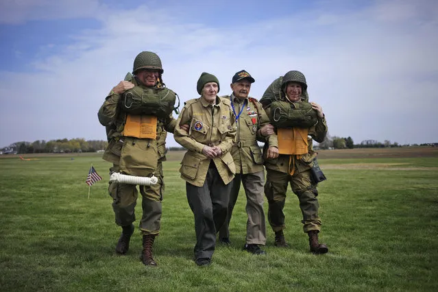 World War II paratrooper veterans Jim “Pee Wee” Martin and Dan McBride walk across the droop zone at Pee Wee's Jump Fest in Xenia, Ohio, U.S., on Friday, April 23, 2021. (Photo by Luke Sharrett for NBC News)