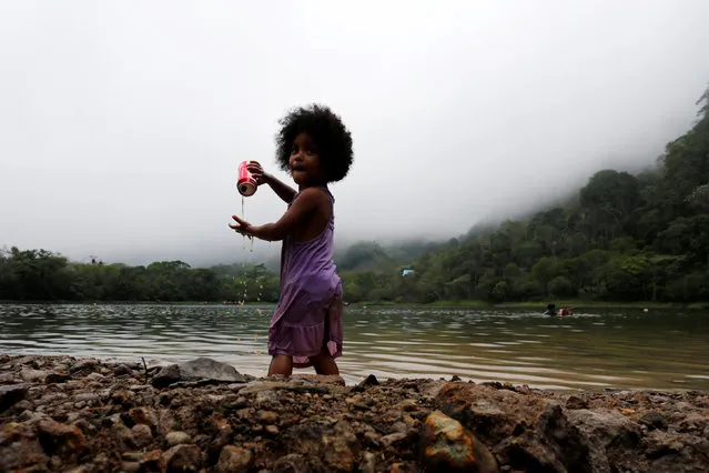 A child plays as she enjoys a day out in Laguna de San Carlos, Panama May 1, 2016. (Photo by Carlos Jasso/Reuters)