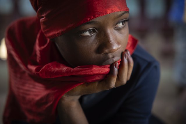 A girl looks on in the family home of the late Ousmane Sylla ahead of his body's arrival in Conakry, Guinea, Monday, April 8, 2024. (Photo by Misper Apawu/AP Photo)
