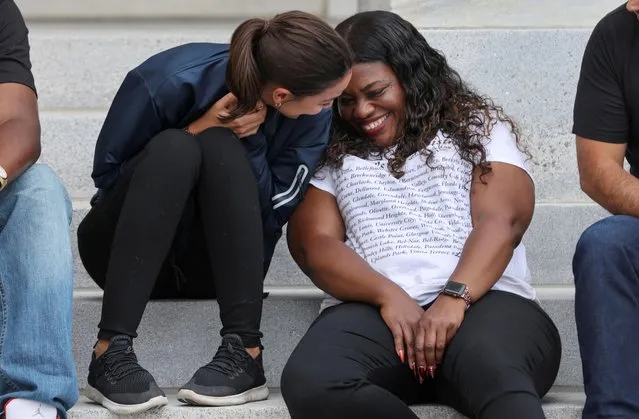 U.S. Rep. Alexandria Ocasio-Cortez (D-NY) sits on the steps of the U.S. Capitol with Rep. Cori Bush (D-MO) as they celebrate news that the White House intends to extend the eviction moratorium in place because of the coronavirus disease (COVID-19) pandemic, on Capitol Hill in Washington, U.S., August 3, 2021. Bush has been protesting and sleeping outside the U.S. Capitol Building at the steps for 5 days in protest of the expiration of the eviction moratorium. (Photo by Evelyn Hockstein/Reuters)
