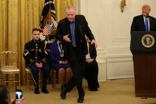Actor Jon Voight dances to music before being awarded the National Medal of Arts by U.S. President Donald Trump inside the East Room of the White House in Washington, U.S., November 21, 2019. (Photo by Tom Brenner/Reuters)