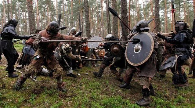 Participants dressed as characters such as elves, dwarves, goblins and orcs from the J.R.R. Tolkien's novel “The Hobbit” re-enact the “Battle of Five Armies” in a forest near the town of Doksy, Czech Republic, June 4, 2016. (Photo by David W. Cerny/Reuters)