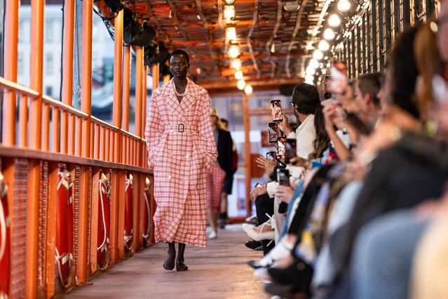 A model presents a creation from the SS25 Tommy Hilfiger collection on the MV John F. Kennedy, a decommissioned Staten Island ferryboat in Manhattan, New York City, U.S., September 8, 2024. (Photo by Caitlin Ochs/Reuters)