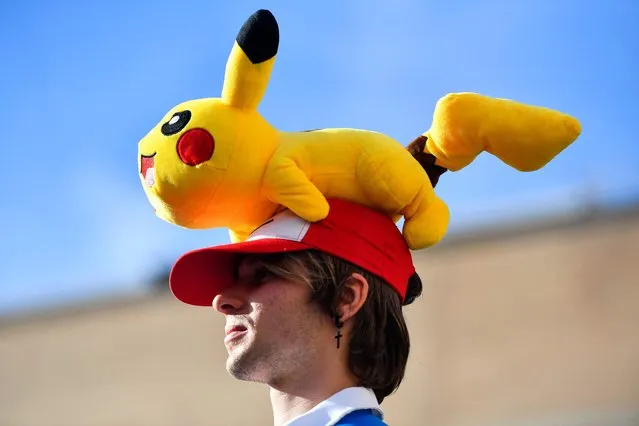 A cosplayer with a Pikachu hat attends the 27th Manga Fair 2021 in Barcelona on October 31, 2021. (Photo by Pau Barrena/AFP Photo)