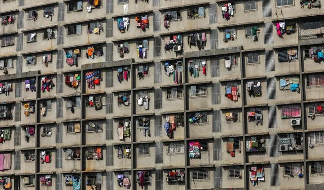 A view of balconies at the Slum Rehabilitation Authority (SRA) housing building in Mumbai, India, 20 January 2020. Mumbai, being the financial capital of India, attracts a large number of people for employment, but because of less income and expensive housing, many people live in shanty-type structures or in slum colonies. The SRA provides an alternative solution for people living in slums. (Photo by Divyakant Solanki/EPA/EFE)