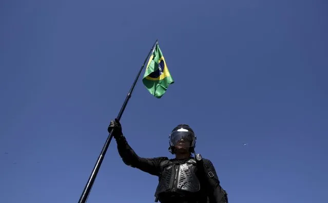 A demonstrator attends a protest against Brazil's President Dilma Rousseff, part of nationwide protests calling for her impeachment, in Copacabana in Rio de Janeiro, Brazil August 16, 2015. (Photo by Ricardo Moraes/Reuters)