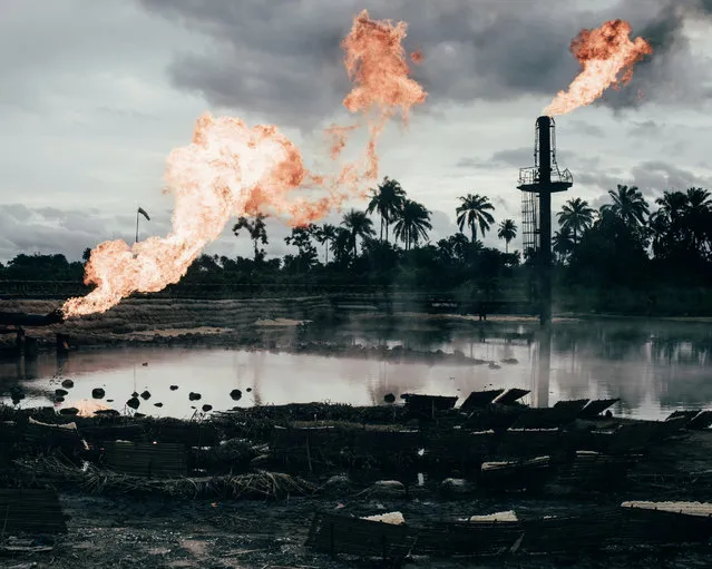 Environment finalist. More than 6,810 oil spills took place between 1976 and 2001 in Niger delta, amounting to 3m barrels, according to a UN report. So far, the Nigerian authorities and oil firms have done little to clean up the delta. Another issue is gas flaring, a byproduct of oil extraction which destroys crops, pollutes water and damages people’s health. Photo essay from Niger by Robin published here. (Photo by Robin Hinsch/Sony World Photography Awards)