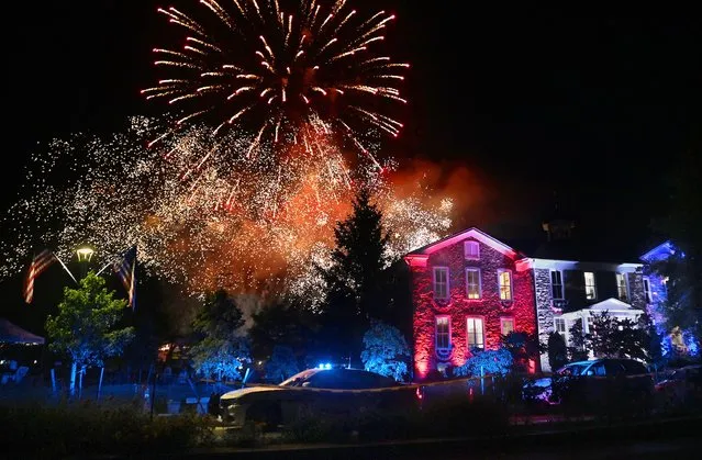 HILLSBORO, VA- JUN 26: Fireworks burst with color over the the Old Stone School in Hillsboro, Virginia on June 26, 2022. The Hillsboro Old Stone School was built in 1874 and is now is used for the city offices and public gatherings. Hillsboro celebrated Independence Day earlier than most towns so as to not compete with many other local jurisdictions that will be having fireworks shows in the coming days. The event included a reading of the Declaration of Independence and several music acts but the highlight was the fireworks show that closed out the night. (Photo by Michael S. Williamson/The Washington Post)