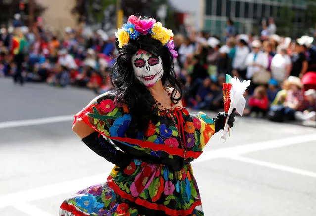 A member of Calgary's Mexican community dances during the Calgary Stampede parade in Calgary, Alberta, Canada July 8, 2016. (Photo by Todd Korol/Reuters)